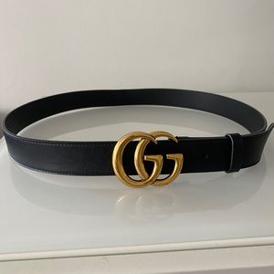 Gucci leather belt with double ‘G’ buckle.
